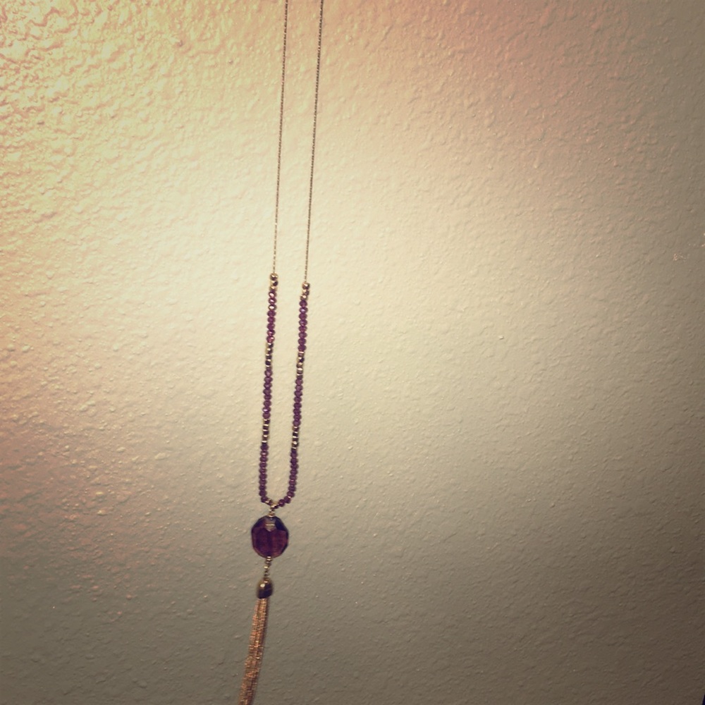 Purple and gold colored necklace